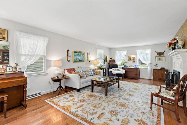 39 Bennets Neck Dr, Bourne, MA 02559 - living area with light wood-style floors and a fireplace