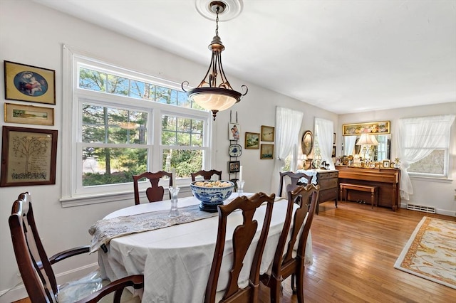 39 Bennets Neck Dr, Bourne, MA 02559 - dining room with plenty of natural light and light wood-type flooring