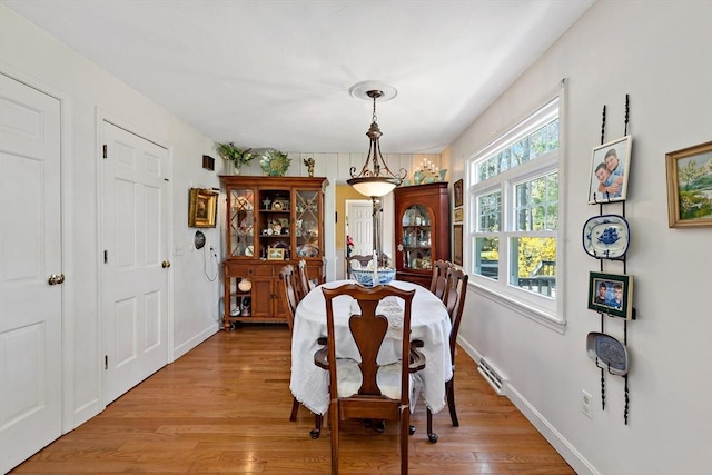 39 Bennets Neck Dr, Bourne, MA 02559 - dining space featuring light wood-type flooring and baseboards