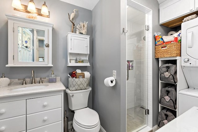 39 Bennets Neck Dr, Bourne, MA 02559 - bathroom featuring stacked washer and clothes dryer, vanity, and a stall shower