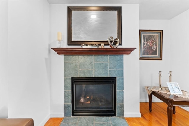 interior details featuring a fireplace and hardwood / wood-style floors