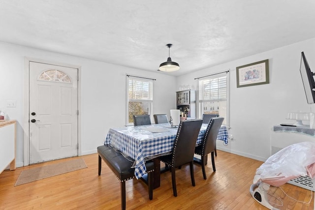 dining room with light wood-type flooring