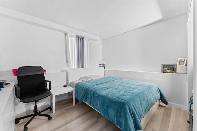 bedroom featuring light wood-type flooring