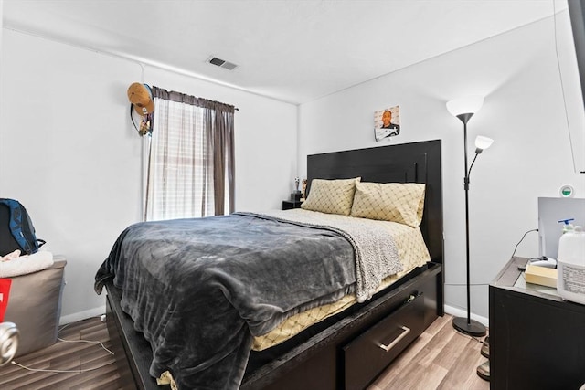 bedroom with wood-type flooring