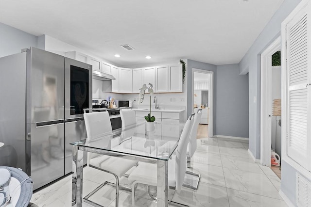 kitchen featuring sink, white cabinets, and appliances with stainless steel finishes