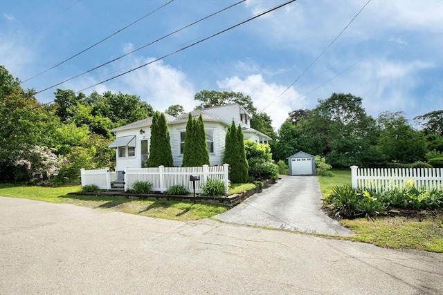 25 Ridge St, Brockton, MA 02302 - view of side of home featuring an outdoor structure, a garage, and asphalt driveway