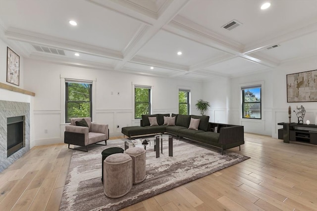 126 Central St Unit 2, Somerville, MA 02145 - living area featuring a decorative wall, light wood-type flooring, healthy amount of natural light, coffered ceiling, and beamed ceiling