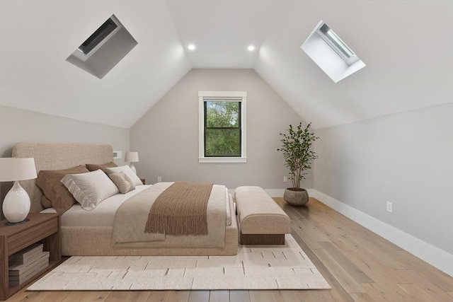 126 Central St Unit 2, Somerville, MA 02145 - bedroom featuring a skylight, wood finished floors, lofted ceiling, and recessed lighting