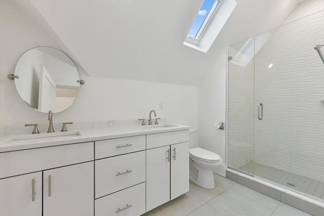 126 Central St Unit 2, Somerville, MA 02145 - bathroom with vaulted ceiling, a skylight, double vanity, a stall shower, and tile patterned floors