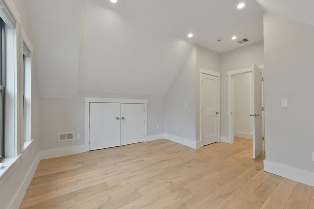 126 Central St Unit 2, Somerville, MA 02145 - bonus room featuring vaulted ceiling, light wood-style flooring, and recessed lighting
