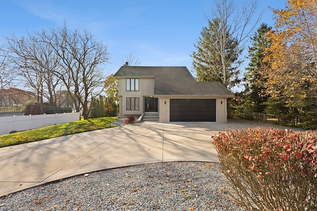 view of front of property featuring a garage