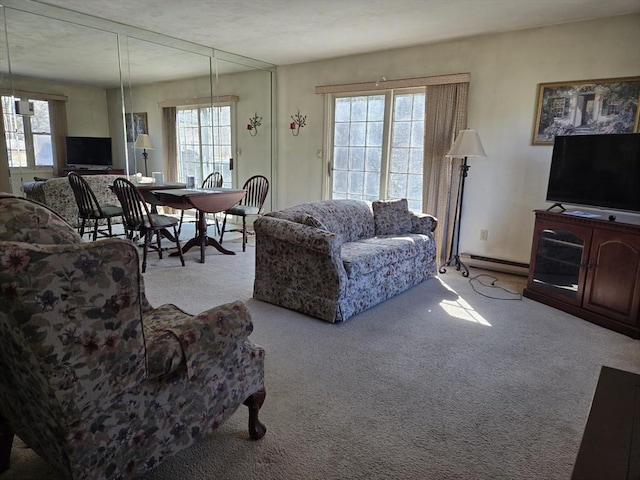 carpeted living room with baseboard heating