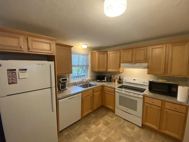 kitchen featuring white appliances, a sink, range hood, and light countertops
