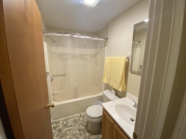 bathroom featuring toilet, shower / bathtub combination with curtain, vanity, and tile patterned flooring
