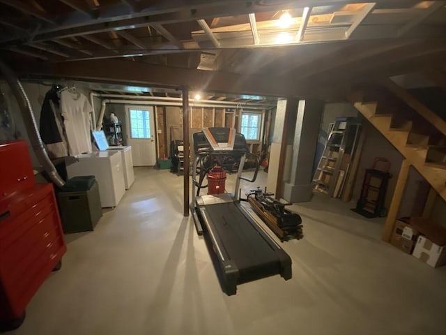 basement with independent washer and dryer, stairs, and plenty of natural light