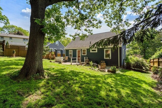 31 Whitman Ave, Melrose, MA 02176 - rear view of property featuring a patio area and roof with shingles