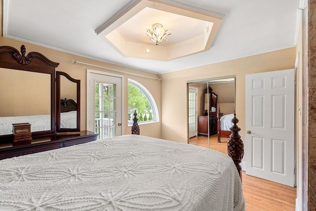 31 Rydberg Ter, Auburn, MA 01607 - bedroom with light wood-style floors, a raised ceiling, access to exterior, a closet, and ornamental molding