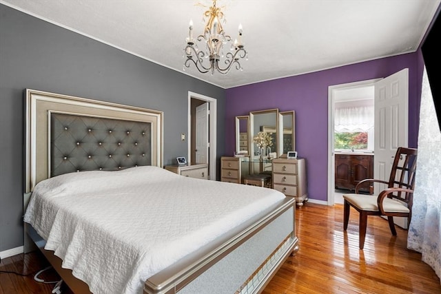 31 Rydberg Ter, Auburn, MA 01607 - bedroom featuring a chandelier, wood-type flooring, and baseboards
