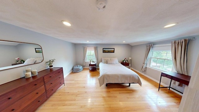 49 Tremont St, Billerica, MA 01821 - bedroom with multiple windows, recessed lighting, light wood-style floors, and baseboards