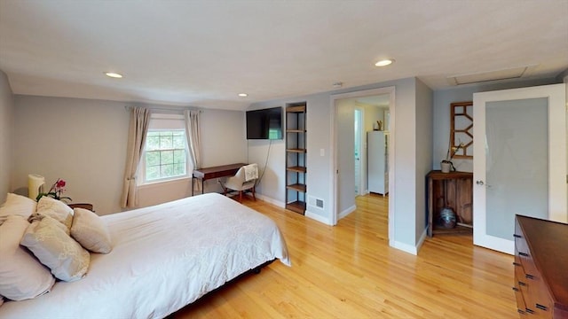 49 Tremont St, Billerica, MA 01821 - bedroom featuring attic access, light wood-type flooring, recessed lighting, freestanding refrigerator, and baseboards