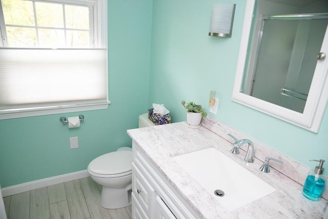 49 Tremont St, Billerica, MA 01821 - full bath featuring vanity, toilet, an enclosed shower, and baseboards