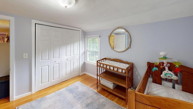 49 Tremont St, Billerica, MA 01821 - bedroom featuring wood finished floors, baseboards, and a closet