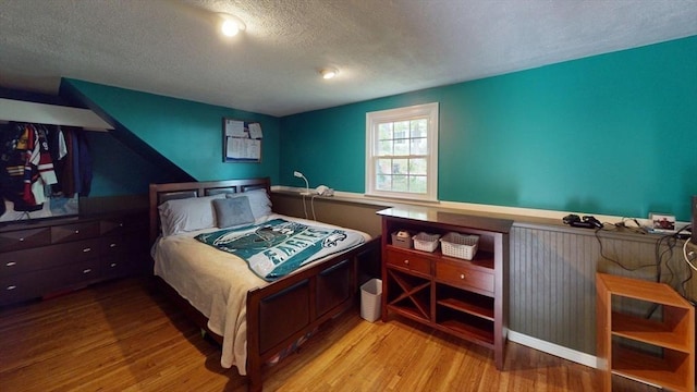 49 Tremont St, Billerica, MA 01821 - bedroom featuring wood finished floors and a textured ceiling