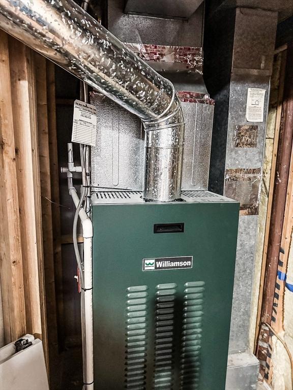 49 Tremont St, Billerica, MA 01821 - utility room featuring heating unit