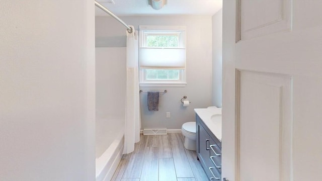49 Tremont St, Billerica, MA 01821 - full bathroom featuring toilet, vanity, baseboards, wood finished floors, and bathing tub / shower combination