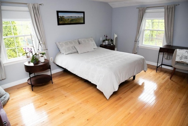 49 Tremont St, Billerica, MA 01821 - bedroom featuring multiple windows, light wood-style floors, and baseboards