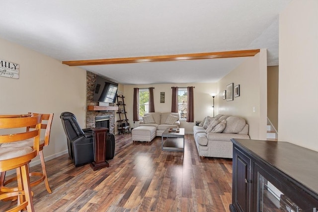 living area featuring dark wood-style floors and a stone fireplace