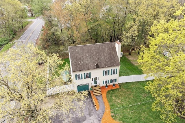view of subject property with a heavily wooded area
