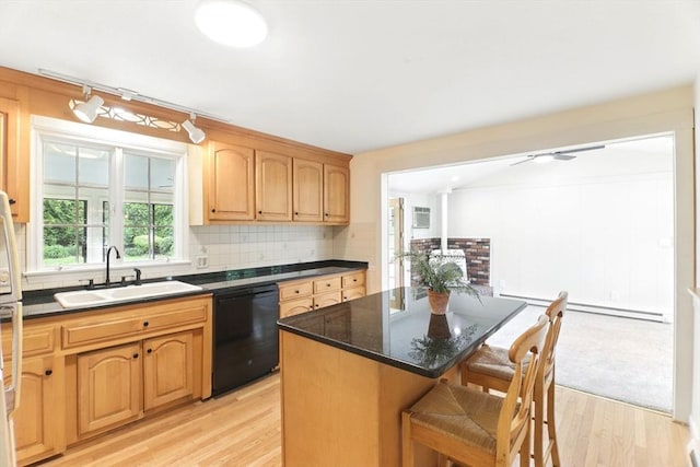 14 Provin Mountain Dr, Agawam, MA 01030 - kitchen featuring black dishwasher, a sink, light wood finished floors, a breakfast bar, and a kitchen island