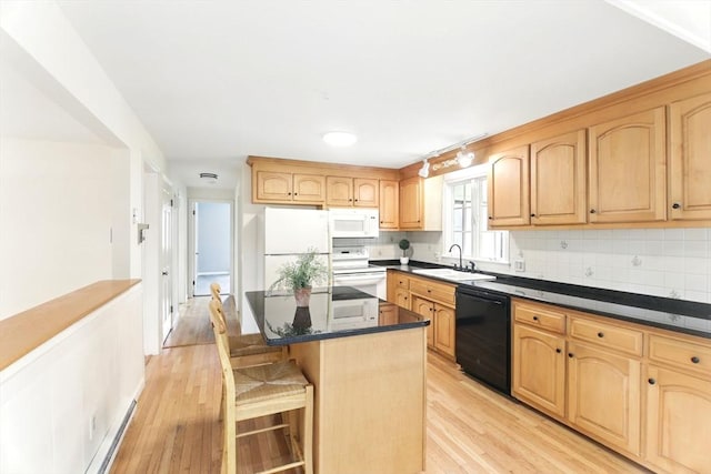 14 Provin Mountain Dr, Agawam, MA 01030 - kitchen with white appliances, a sink, light wood finished floors, and backsplash