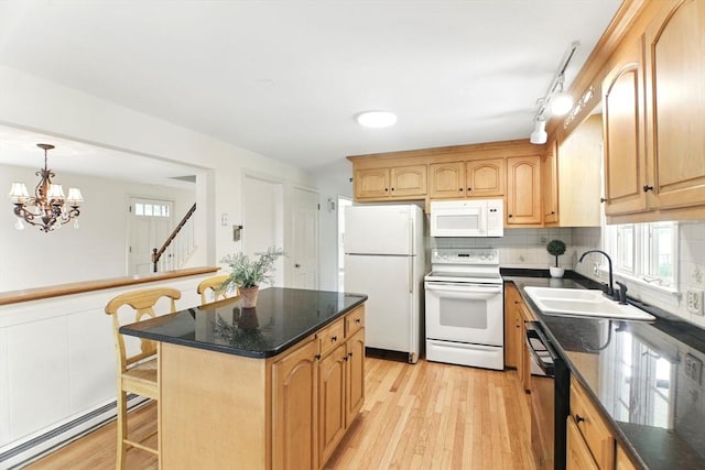 14 Provin Mountain Dr, Agawam, MA 01030 - kitchen featuring white appliances, a sink, a baseboard heating unit, light wood-style floors, and decorative backsplash