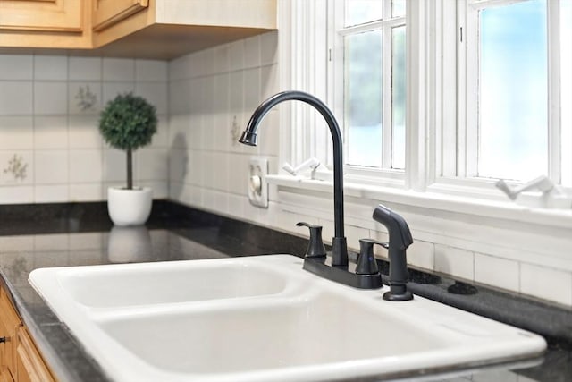 14 Provin Mountain Dr, Agawam, MA 01030 - kitchen view of a sink, decorative backsplash, light brown cabinetry, and dark countertops
