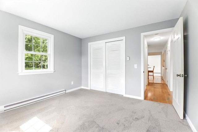 14 Provin Mountain Dr, Agawam, MA 01030 - unfurnished bedroom featuring a baseboard heating unit, carpet flooring, a closet, and baseboards