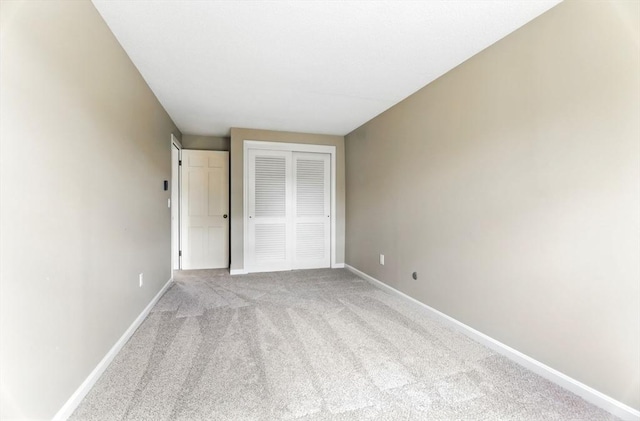14 Provin Mountain Dr, Agawam, MA 01030 - unfurnished bedroom featuring light carpet, baseboards, and a closet