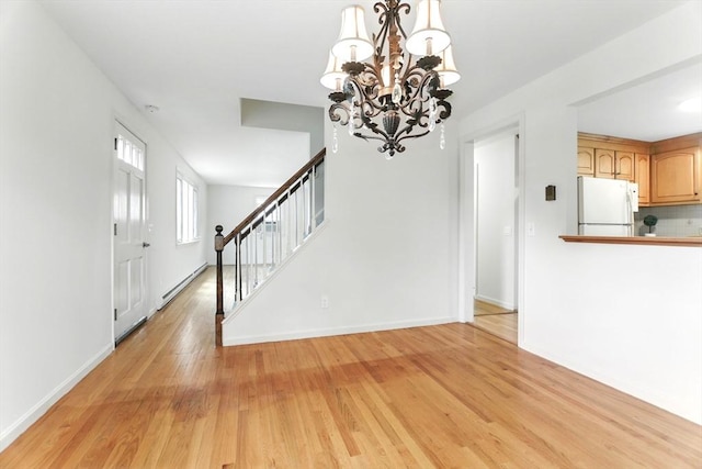 14 Provin Mountain Dr, Agawam, MA 01030 - foyer featuring baseboard heating, stairway, a chandelier, light wood-style floors, and baseboards