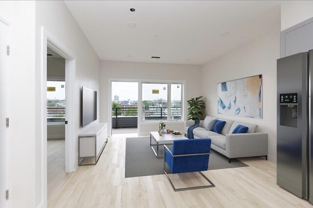 living room featuring light wood finished floors and visible vents