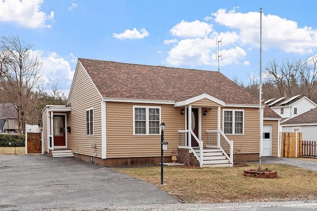 bungalow-style house featuring a front yard