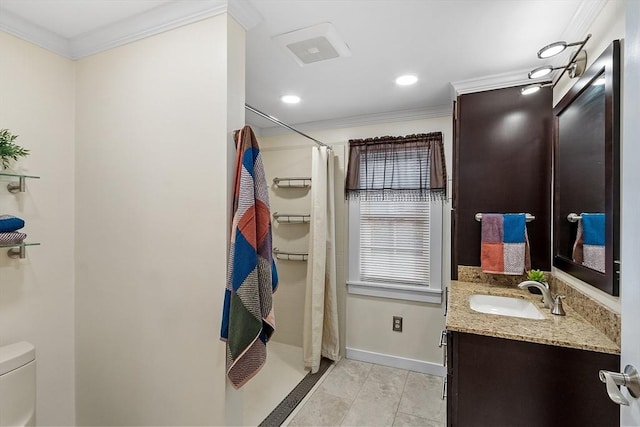 bathroom featuring tile patterned floors, vanity, toilet, and ornamental molding