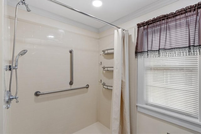 bathroom with a shower with curtain and ornamental molding