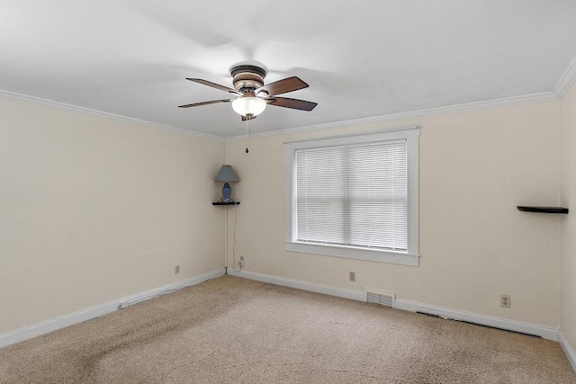 carpeted empty room with crown molding and ceiling fan