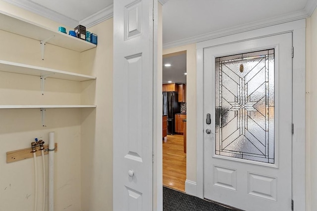 interior space featuring carpet floors and ornamental molding