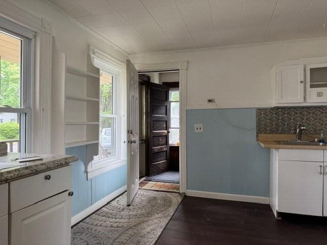 40 Allen St, Greenfield, MA 01301 - kitchen featuring a sink, white cabinets, dark wood-type flooring, open shelves, and crown molding