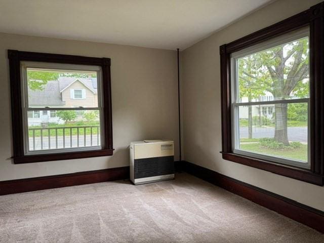 40 Allen St, Greenfield, MA 01301 - unfurnished room featuring healthy amount of natural light, light carpet, and baseboards
