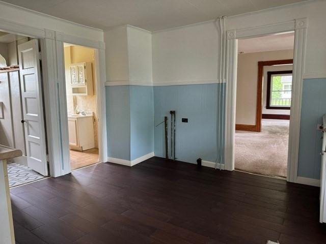 40 Allen St, Greenfield, MA 01301 - empty room with dark wood-style flooring and baseboards