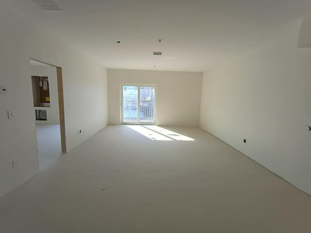 unfurnished room featuring concrete floors and visible vents