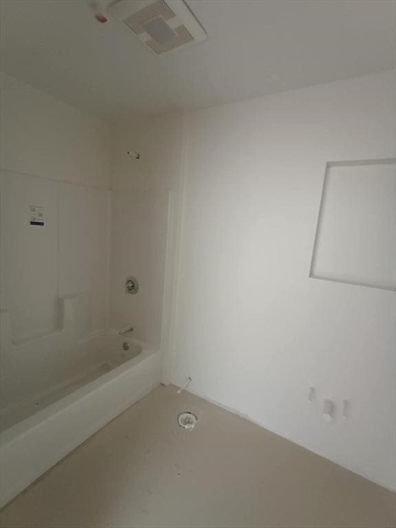 bathroom featuring tub / shower combination and visible vents